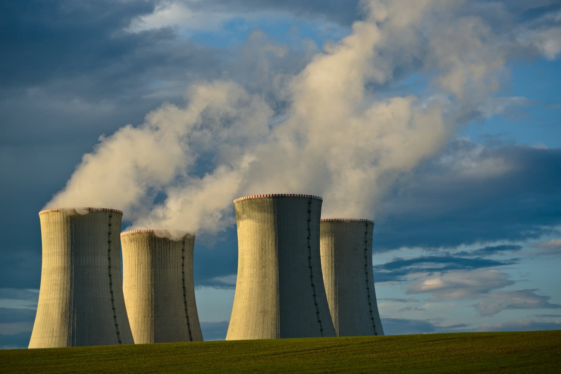 Power station cooling towers under a bright sky