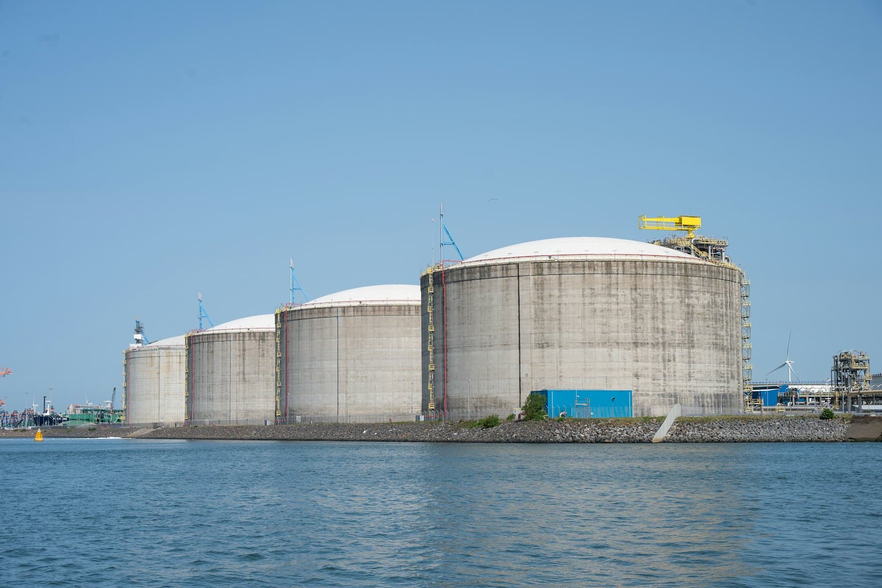 LNG storage tanks at a coastal terminal